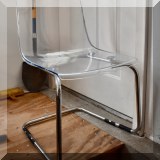 F65. 2 Molded clear cantilever chairs from Ikea. 